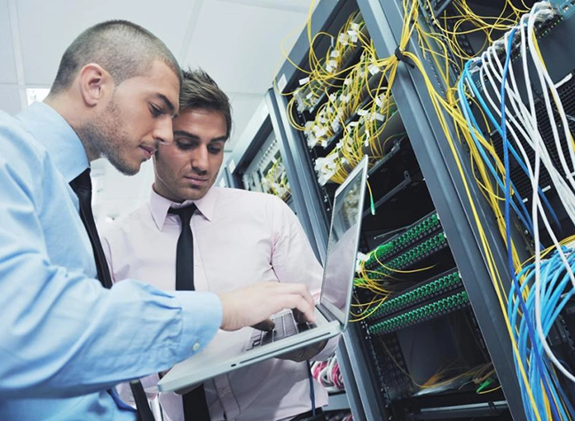 Two men in computer server room